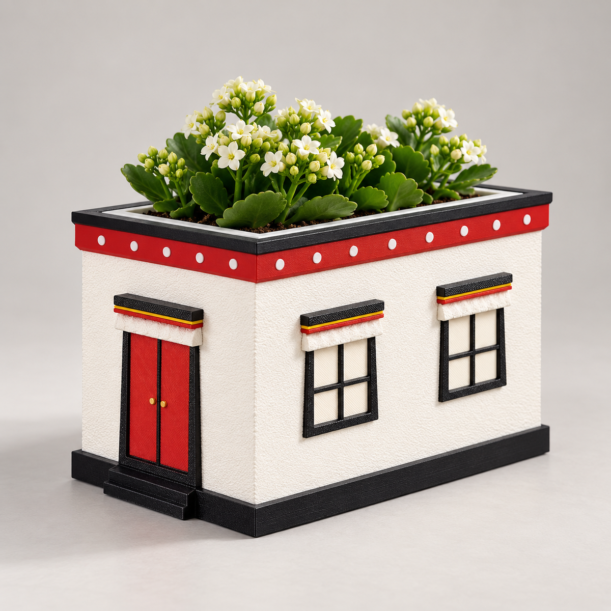 White Tibetan Home Planter with small white flowers, studio view